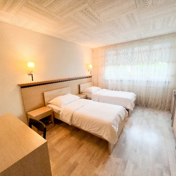 Bright twin-bed student accommodation room